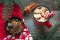 Christmas tradition drink. Mug hot coffee with marshmallow, red candy cane on the wooden background. New Year. Holiday card. Rusti Royalty Free Stock Photo