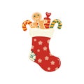 Christmas traditional sock with sweets, gingerbread gingerbread man.