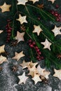 Christmas traditional star shaped cookies with red currant berries and spruce on the table Royalty Free Stock Photo