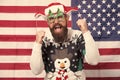 Christmas traditions and observances changed greatly over time. American bearded hipster guy joined cheerful celebration