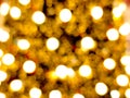 christmas tree abstract bokeh blur light circle red orange and golden glowing flare pattern black background Royalty Free Stock Photo