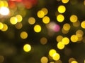 christmas tree abstract bokeh blur light circle red orange and purple glowing flare pattern black background Royalty Free Stock Photo