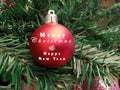 Christmas tree accessory & decoration closeup. Preparing & decorating Christmas tree with Merry Christmas & Happy New Year text or Royalty Free Stock Photo