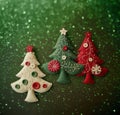 Christmas tree applique with space for text. Christmas tree made of fabric, buttons isolated on green background with Royalty Free Stock Photo
