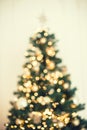 Christmas tree background with blurred, sparking, glowing. Royalty Free Stock Photo