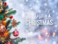 Christmas tree background and Christmas decorations with blurred, sparking, glowing and text Merry Christmas and Happy New Year. Royalty Free Stock Photo