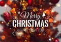 Christmas tree background and Christmas decorations with blurred, sparking, glowing and text Merry Christmas and Happy New Year. Royalty Free Stock Photo