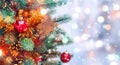 Christmas tree background and Christmas decorations with snow, blurred, sparking, glowing. Happy New Year and Xmas Royalty Free Stock Photo