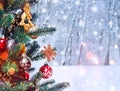 Christmas tree background and Christmas decorations with snow, blurred, sparking, glowing. Happy New Year and Xmas Royalty Free Stock Photo