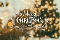 Christmas tree background and Christmas decorations with blurred, sparking, glowing and text Merry Christmas and Happy New Year Royalty Free Stock Photo