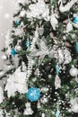 Christmas tree background and Christmas decorations with snow, blurred, sparking, glowing. Royalty Free Stock Photo