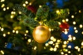 Christmas Tree Ball Ornament Festive Holiday Decoration Gold Closeup Depth of Field Bokeh Centered