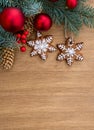 Christmas tree with Christmas balls, christmas gingerbread and cones spruce on a wooden background with space for text. Top view, Royalty Free Stock Photo