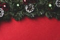 Christmas tree with balls and pine cones on red flannel background Royalty Free Stock Photo