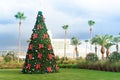 Christmas tree with baubles and palm trees in tropical Florida