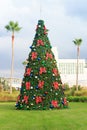 Christmas tree with baubles and palm trees in tropical Florida