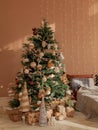 Christmas tree by the bed. Holidays, present, childhood, happiness concept