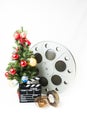 Christmas tree with big cinema reel and movie clapperboard