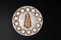 Christmas tree biscuit with almond stars.