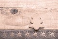 Christmas tree biscuit on wooden background. Snow flaks image. Christmas tree ornament