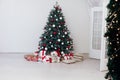 Christmas tree blue pine with gifts interior decor white room new year winter holiday Royalty Free Stock Photo