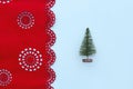 Christmas tree on blue and red background with snowflakes in minimal style. Decorative Christmas ornaments, new year and winter Royalty Free Stock Photo