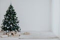 Christmas tree with blue in a white room with toys for Christmas Royalty Free Stock Photo