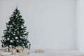 Christmas tree with blue in a white room with toys for Christmas Royalty Free Stock Photo