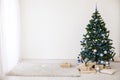 Christmas tree with blue in a white room with toys for Christmas Royalty Free Stock Photo