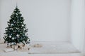 Christmas tree with blue in a white room with toys for Christmas Royalty Free Stock Photo