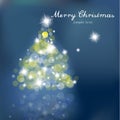 Christmas tree with blurred lights on blue background. Royalty Free Stock Photo