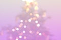 Christmas tree blurry lights on light pink background Royalty Free Stock Photo