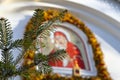Christmas tree branch on the background of the Orthodox icon and the cross. Royalty Free Stock Photo