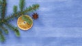 Christmas tree branch on blue wood table Royalty Free Stock Photo