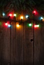 Christmas tree branch and colorful lights Royalty Free Stock Photo