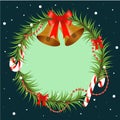 Christmas tree branch decorated with bells and red bow. Round frame with copy space, design element for for Christmas Royalty Free Stock Photo