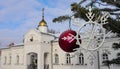 Christmas tree branch with decorations on the background of the golden dome of the Orthodox Church. Bright winter day. Winter is C Royalty Free Stock Photo