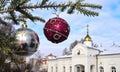 Christmas tree branch with decorations on the background of the golden dome of the Orthodox Church. Bright winter day. Winter is C Royalty Free Stock Photo