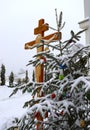 Christmas tree branch with decorations on the background of the Orthodox cross with a crucifix. The Orthodox Church. Winter is Chr Royalty Free Stock Photo