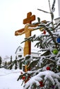 Christmas tree branch with decorations on the background of the Orthodox cross with a crucifix. The Orthodox Church. Winter is Chr Royalty Free Stock Photo