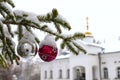 Christmas tree branch with decorations on the background of the Orthodox cross with a crucifix. The Orthodox Church. Winter is Chr