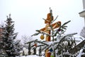 Christmas tree branch with decorations on the background of the Orthodox cross with a crucifix. The Orthodox Church. Winter is Chr