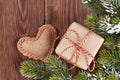 Christmas tree branch with gift box and heart toy Royalty Free Stock Photo