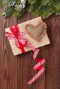 Christmas tree branch with gift box and heart toy Royalty Free Stock Photo