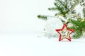 Christmas tree branch, glass balls and decorative wooden star