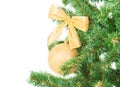 Christmas tree branch with golden decorations beckground