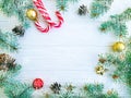 Christmas tree branch, pinecone, festive snow candy on a white wooden background card ball Royalty Free Stock Photo