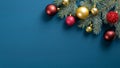 Christmas tree branch with red and golden balls on blue background. Flat lay, top view. Xmas greeting card mockup with copy space Royalty Free Stock Photo