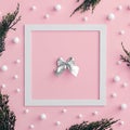 Christmas tree branch and snowball on pink background Royalty Free Stock Photo