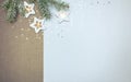 frosty christmas tree branch decorated with glowing star lights garland. winter holiday background